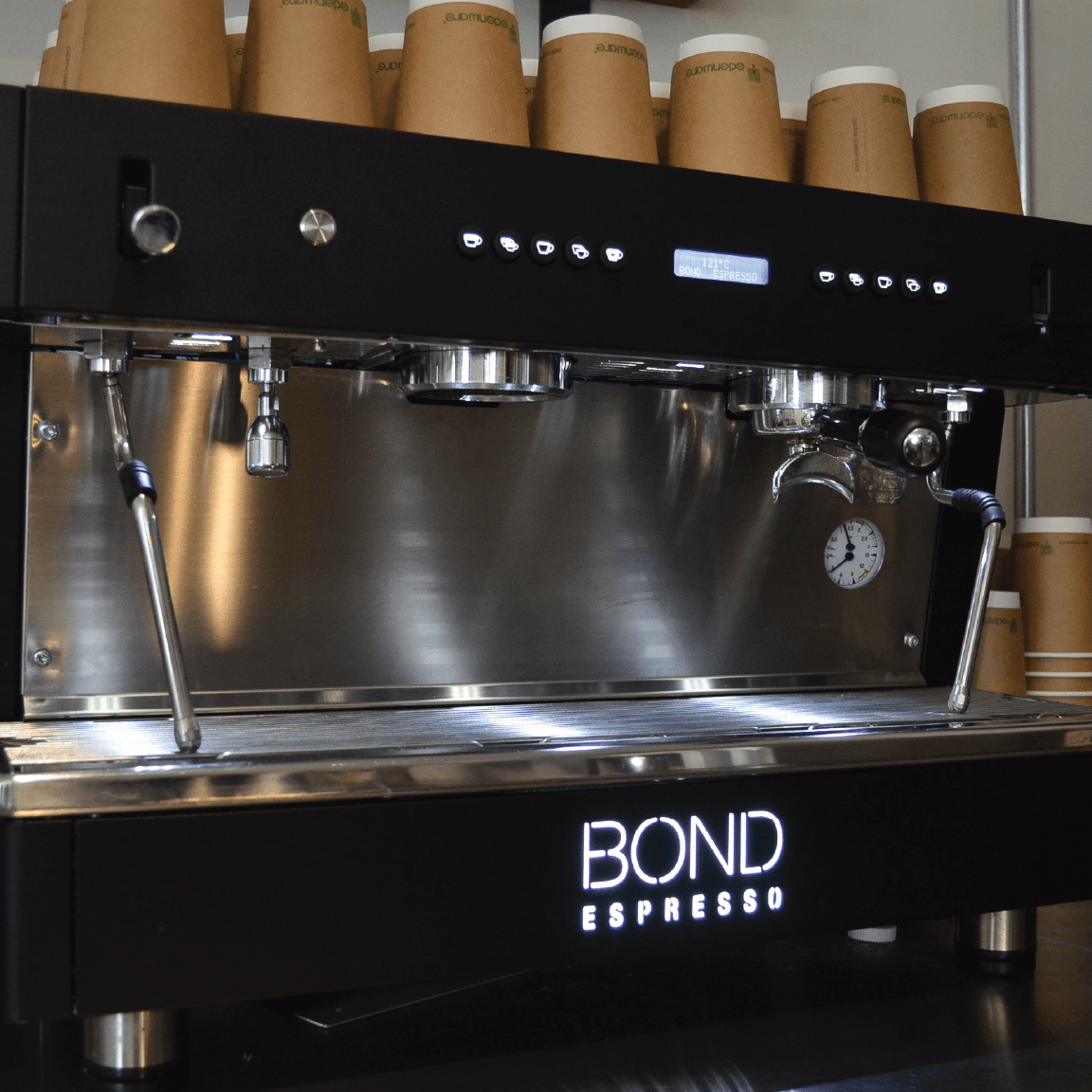 Bond Espresso 2 Group commercial espresso machine with twin steam wands, hot water outlet, and stainless steel body.