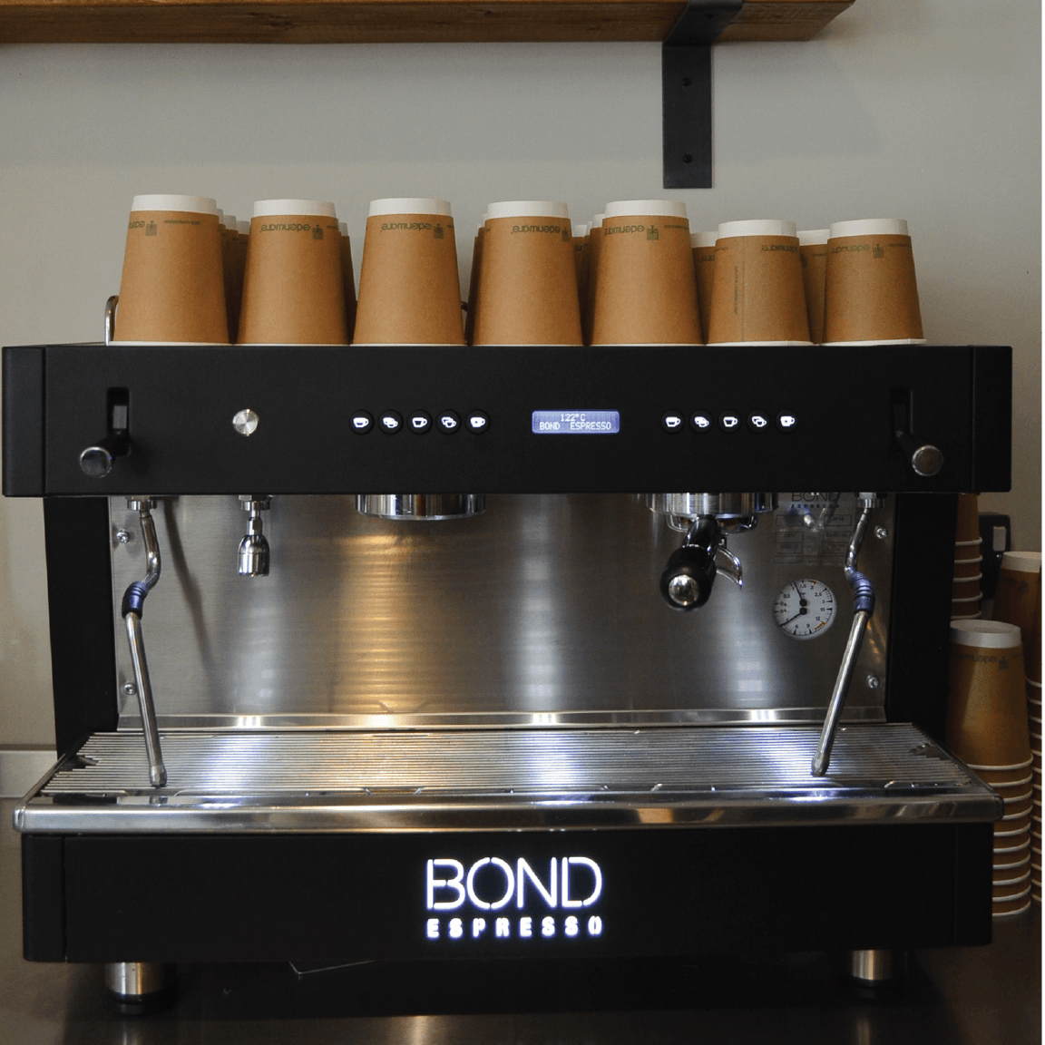 Bond Espresso 2 Group commercial espresso machine with twin steam wands, hot water outlet, and stainless steel body.