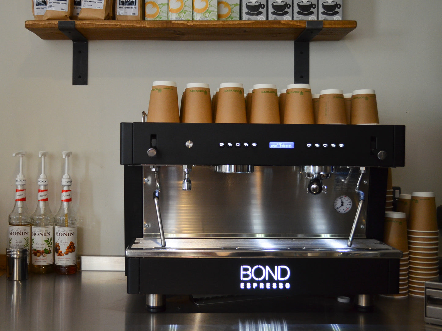 Bond Espresso 2 Group commercial espresso machine with twin steam wands, hot water outlet, and stainless steel body.