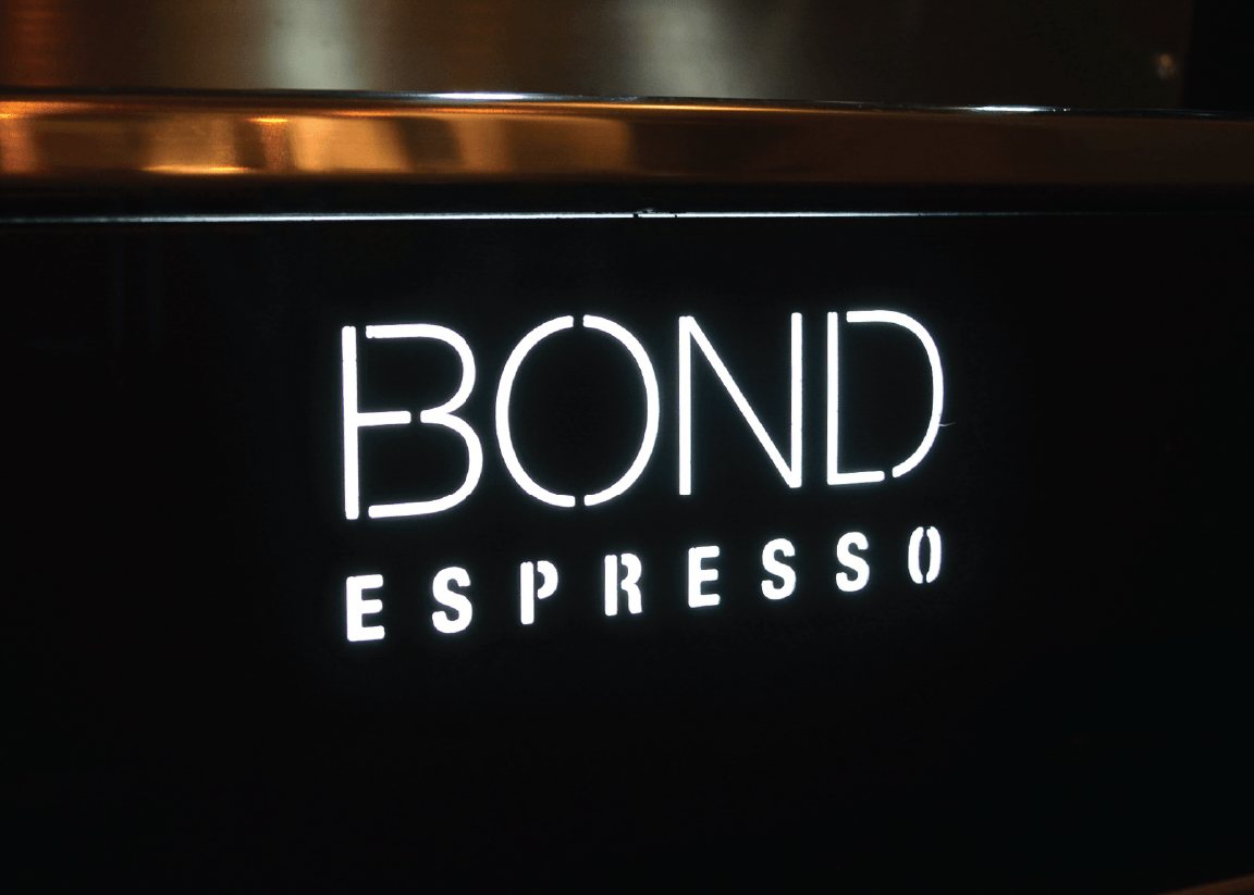 Bond Espresso 2 Group commercial espresso machine with twin steam wands, hot water outlet, and stainless steel body.